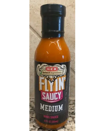 Photo of Medium Flyin' Saucy Wing Sauce by H-E-B