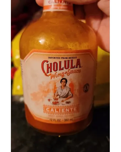 Photo of Caliente Spicy Arbol Peppers Wing Sauce by Cholula