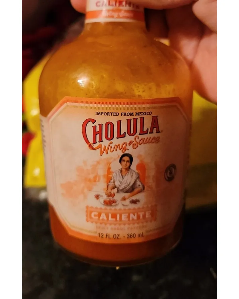 Photo of Caliente Spicy Arbol Peppers Wing Sauce by Cholula