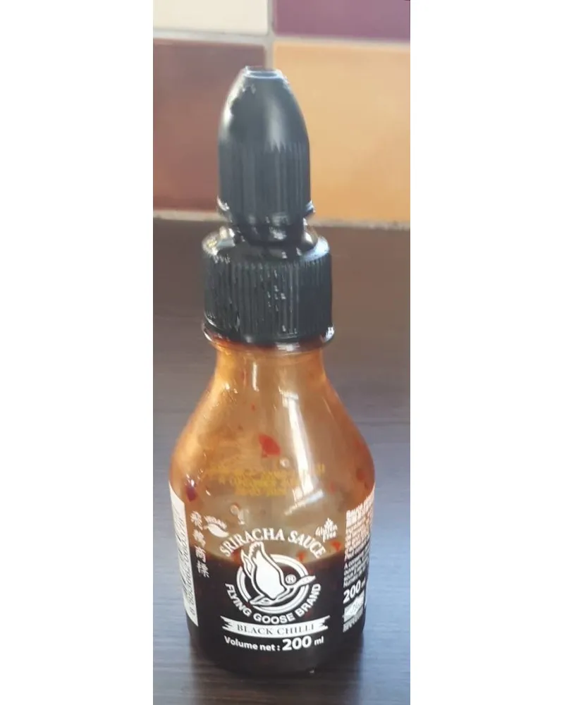 Photo of Sriracha sauce black chili by Flying Goose Brand